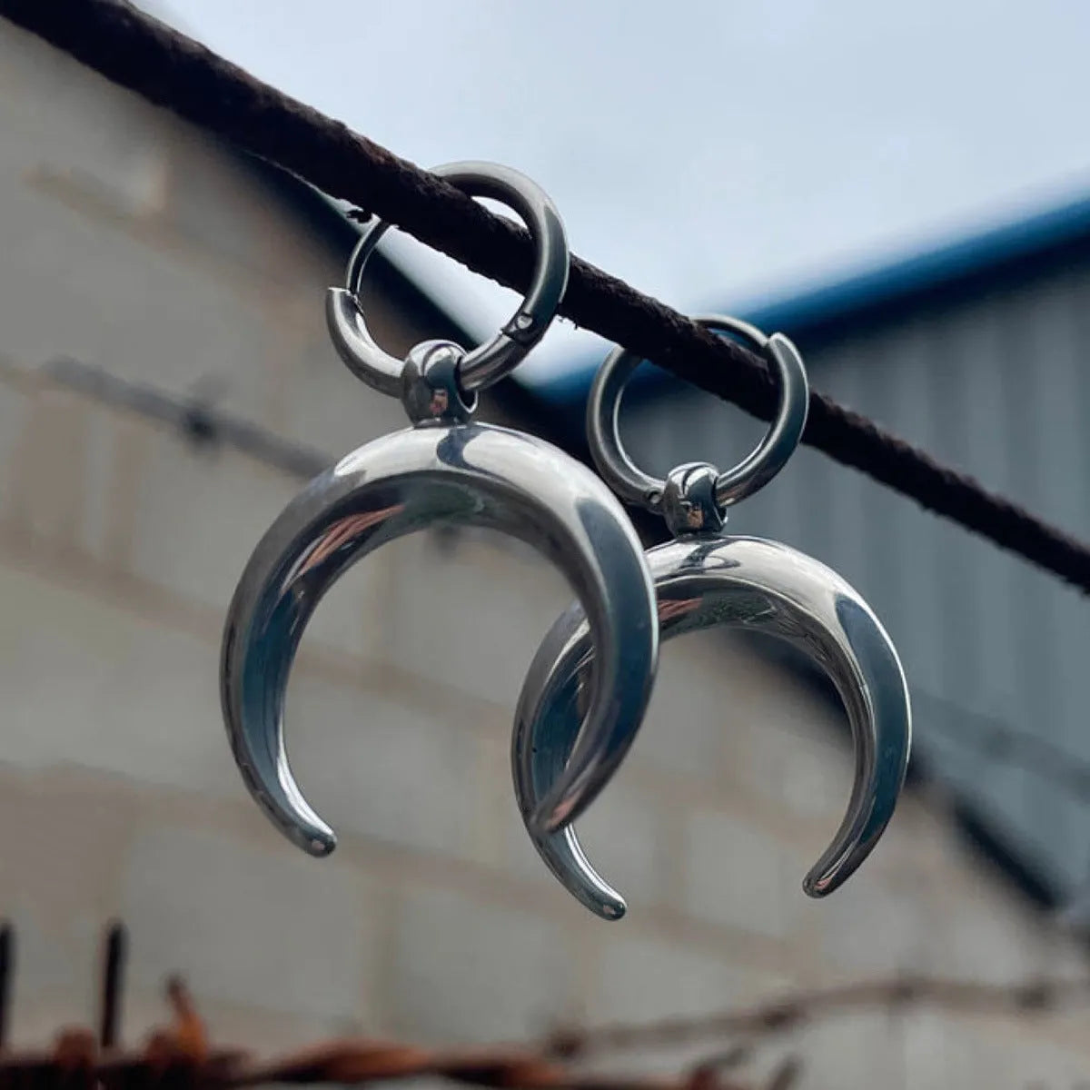 Silver geometric hoop earrings with moon detail, punk-style gothic design, ear clip fastening