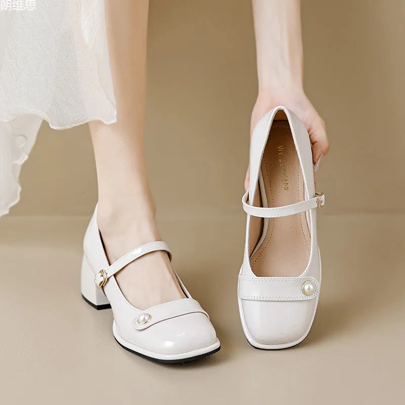 French-style women's chunky heel pumps with buckle fastening, square toe, in patent leather with rubber sole.