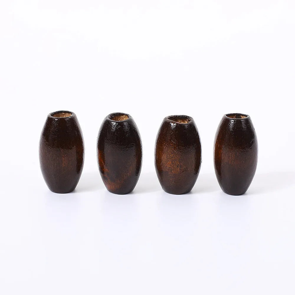 Oval wooden beads in dark coffee colour with M-shaped raised profile