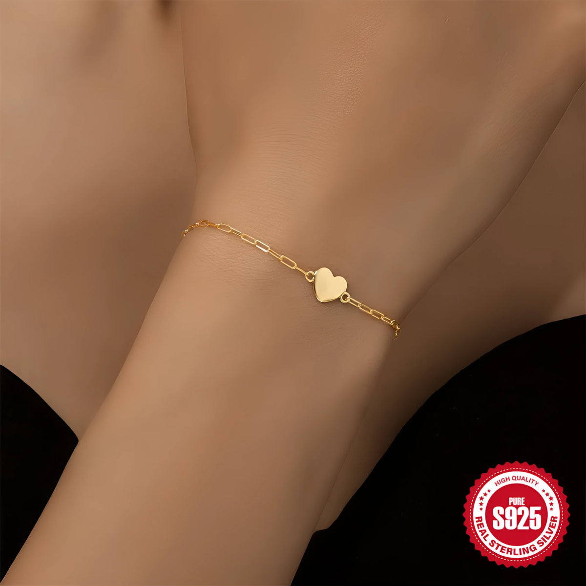 Gold S925 sterling silver women's bracelet with glossy geometric heart and clip chain.
