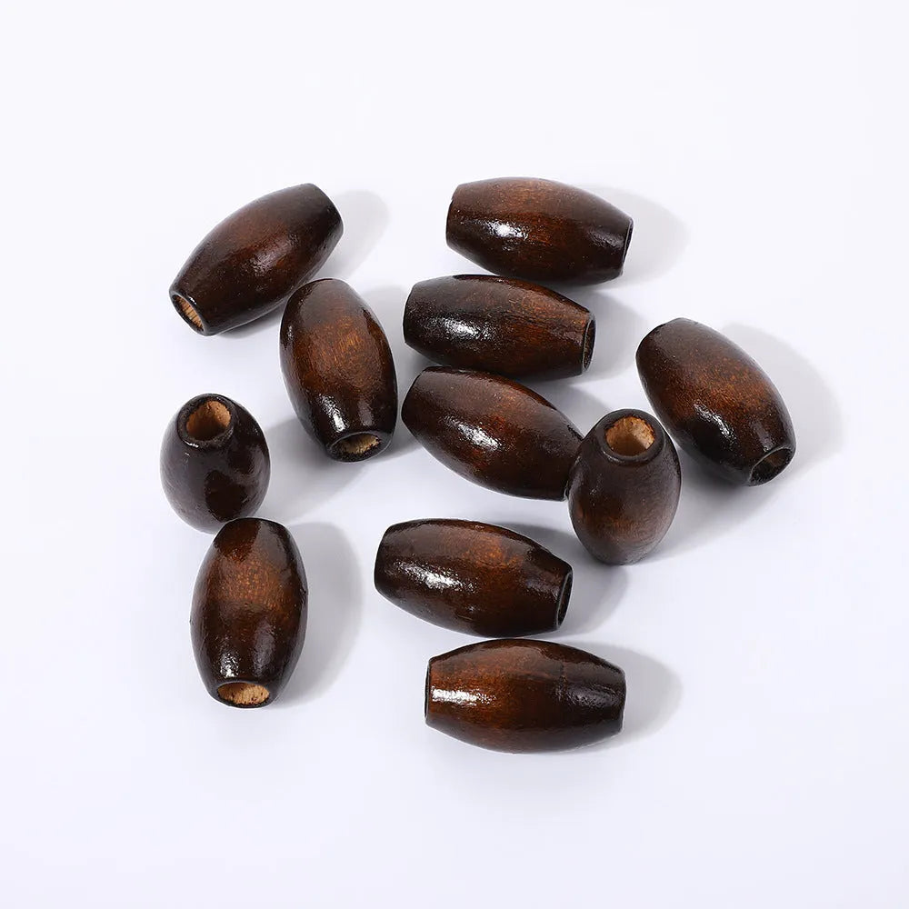 Oval wooden beads in dark coffee colour with M-shaped raised profile