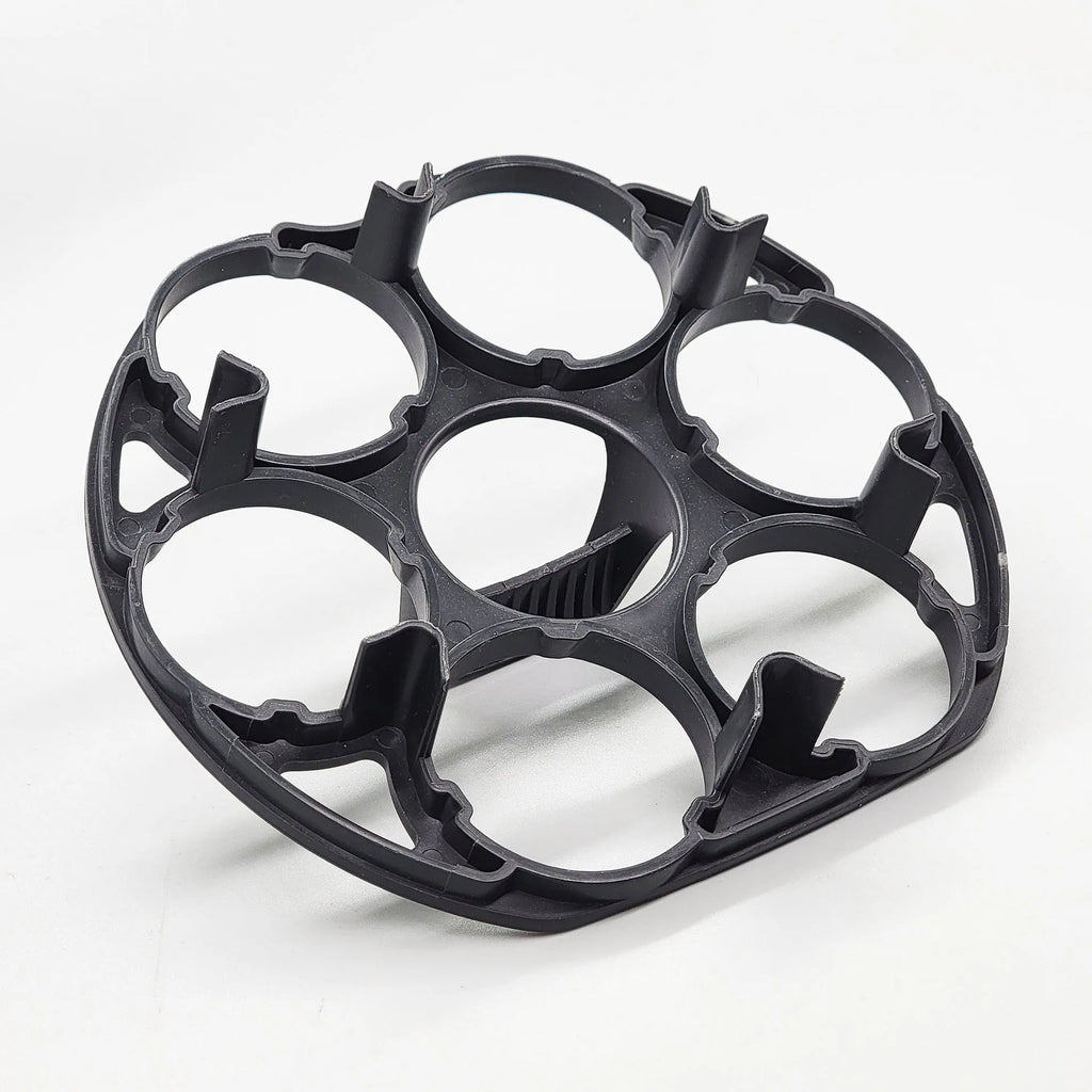Black plastic egg holder measuring 13.8×12.6×5.7cm with retainer compartments for secure egg storage