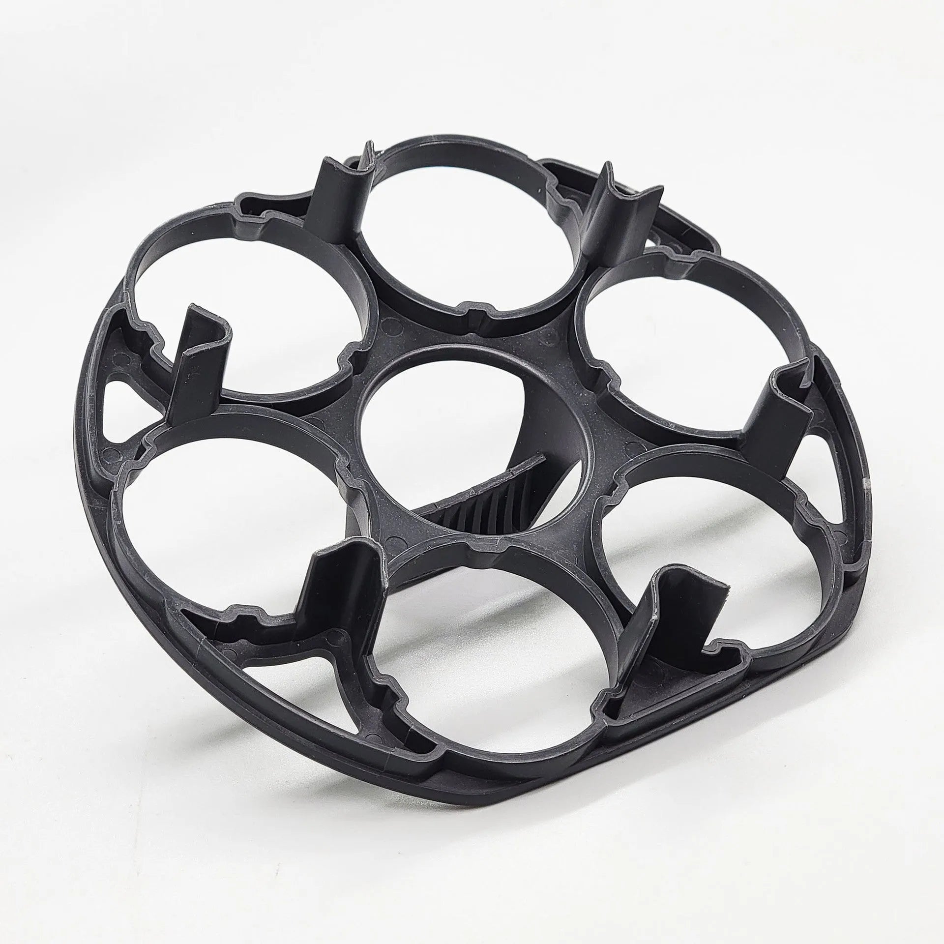 Black plastic egg holder measuring 13.8×12.6×5.7cm with retainer compartments for secure egg storage