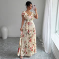 V-neck floral print dress with oversized swing skirt and ruffled sleeves in apricot colour, showing high waist and pleated details