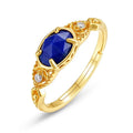 Elliptical lapis lazuli ring with sterling silver setting showing geometric design and natural stone colour variations