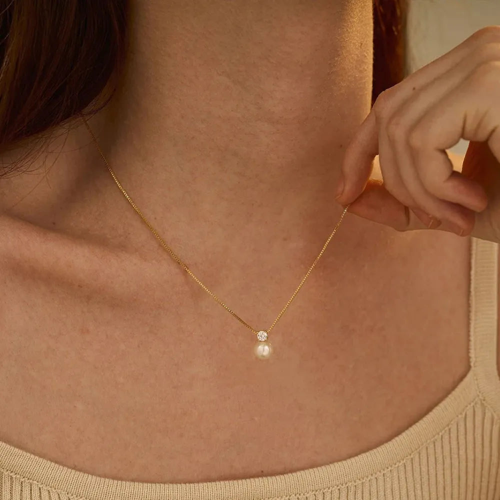 St Delan stainless steel necklace with imitation pearl and zircon pendant in gold and steel colour options