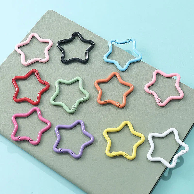 Zinc alloy five-pointed star keychain in light pink colour for backpack attachment