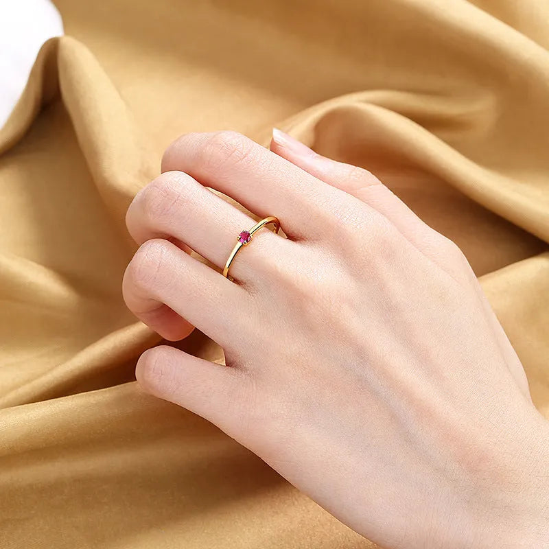 Copper geometric ring with single diamond accent in circle design, available in white, red, green, blue colours