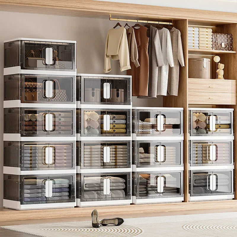 Foldable white storage locker with wheels showing 4 shelves containing shoes and toys