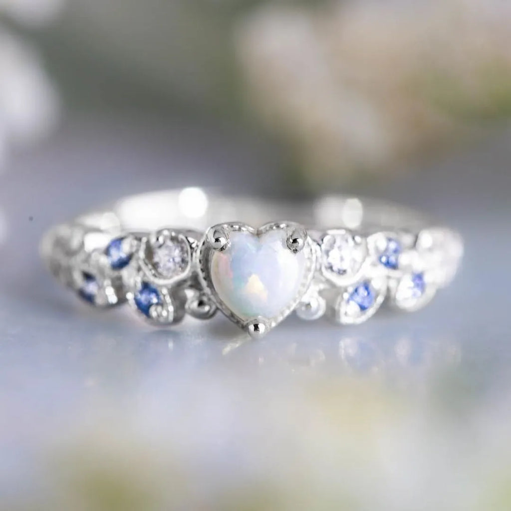 White heart-shaped women's alloy ring with electroplated finish, shown in size options 5-11