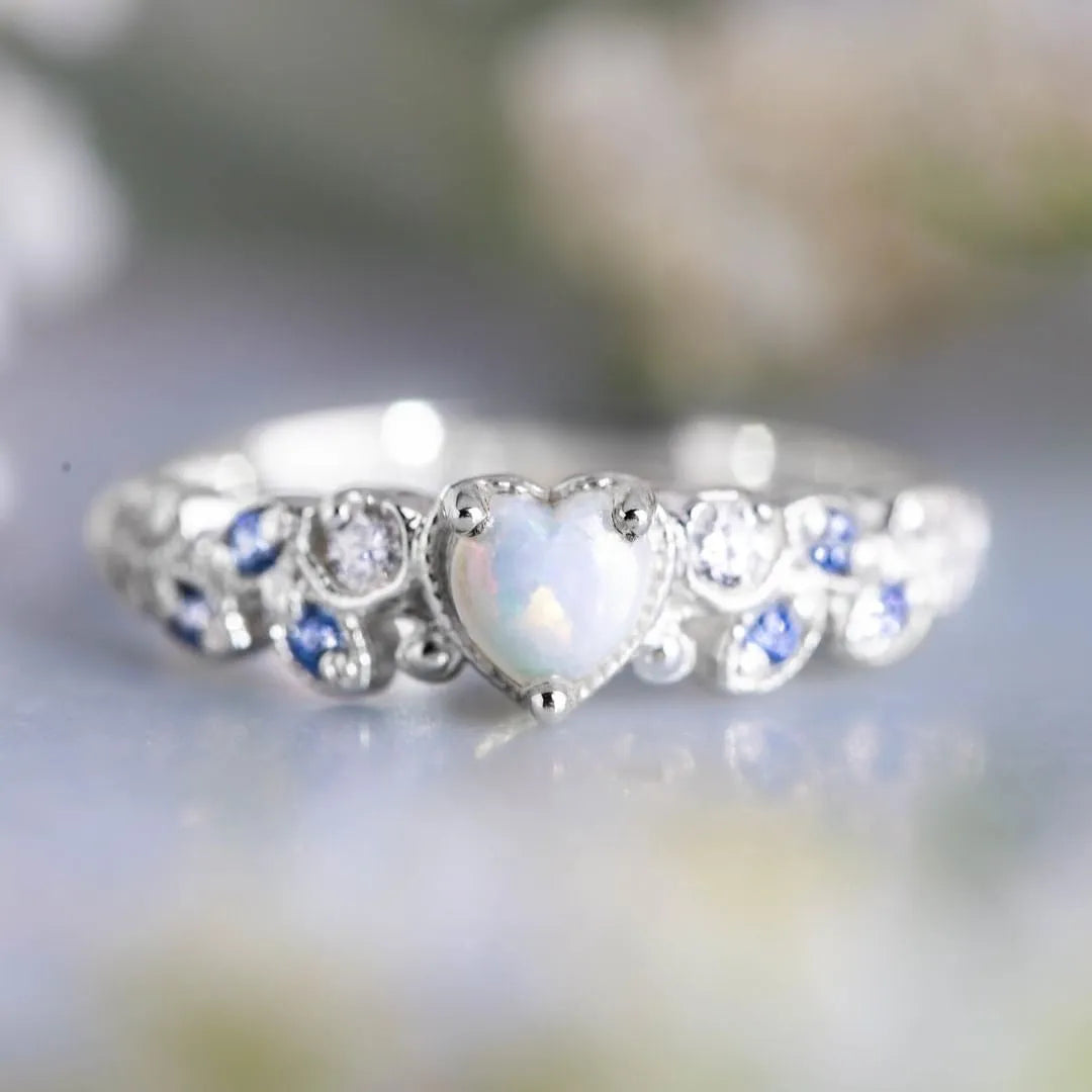 White heart-shaped women's alloy ring with electroplated finish, shown in size options 5-11