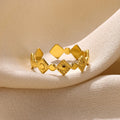 Geometric titanium steel women's ring with gold diamond finish, adjustable free-size band, and hypoallergenic properties