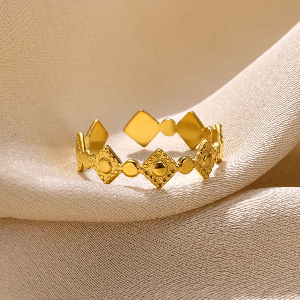 Geometric titanium steel women's ring with gold diamond finish, adjustable free-size band, and hypoallergenic properties