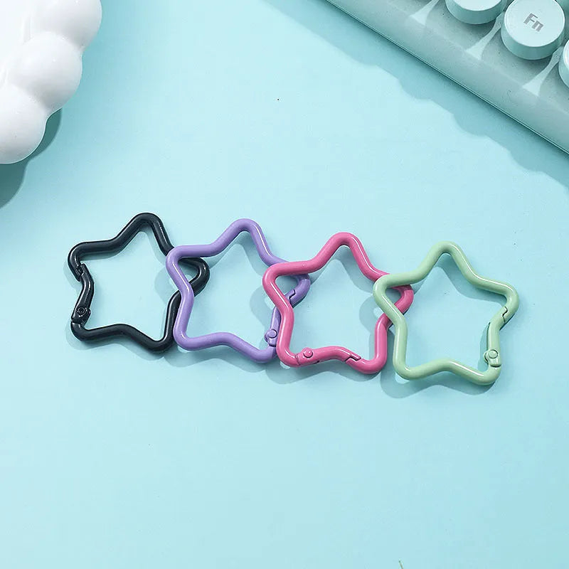 Zinc alloy five-pointed star keychain in light pink colour for backpack attachment