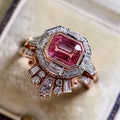 Rose gold alloy women's ring with geometric design and ruby accent, available in sizes 5 to 11.
