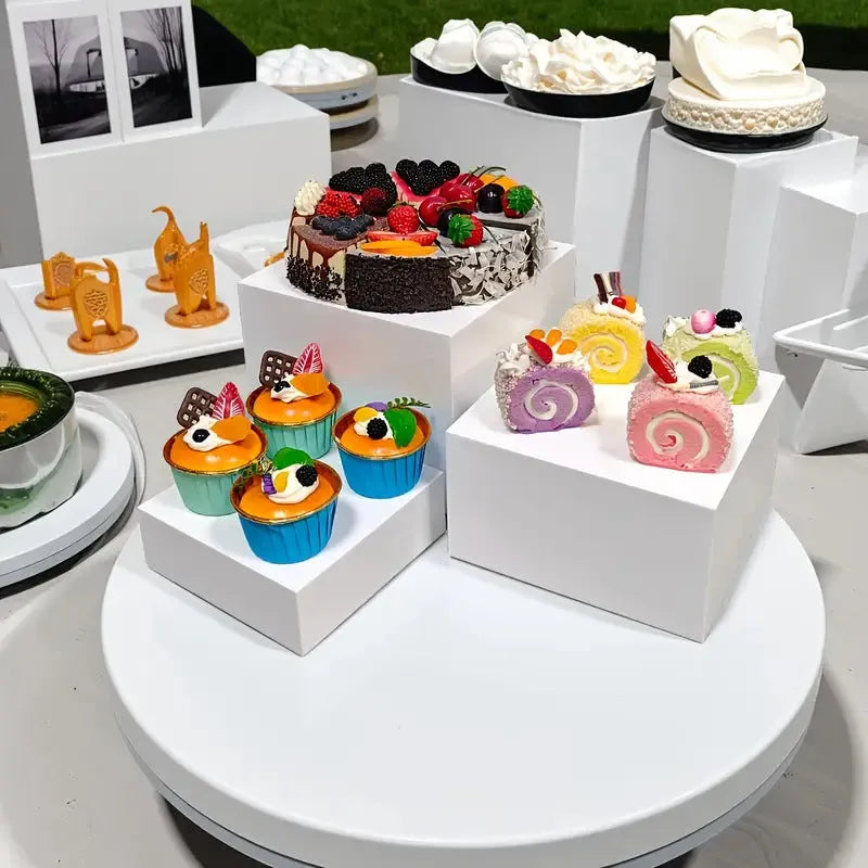 White modular cube dessert display stand with 6 pieces arranged in tiered configuration