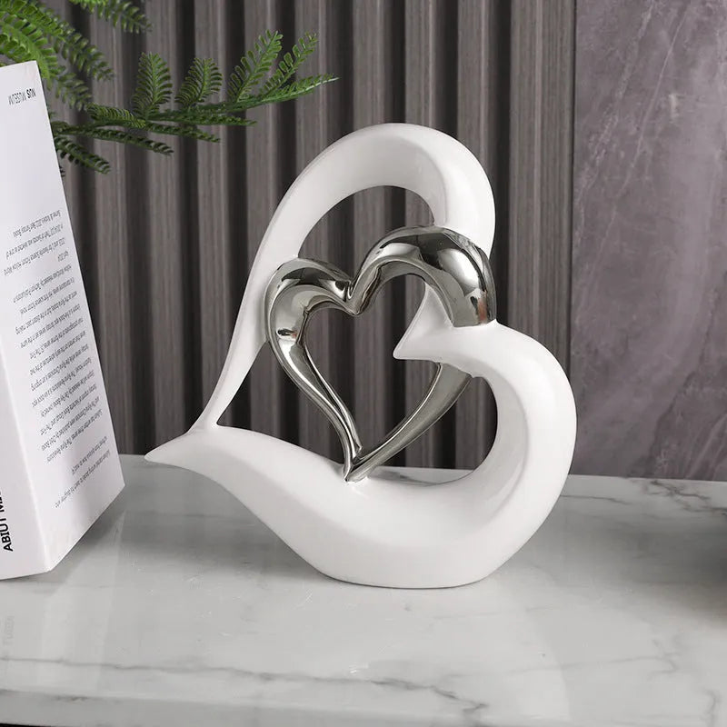 White porcelain love heart ornament with geometric design in metallic finish, approximately 19cm in size