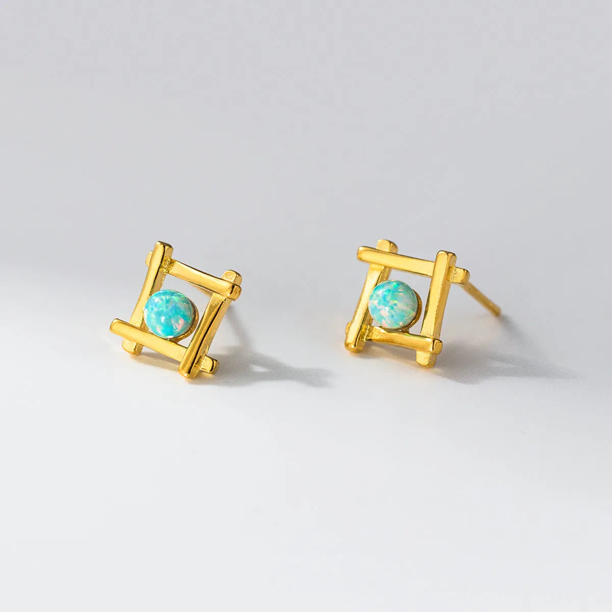 Women's geometric cross quadrangle stud earrings in 925 silver with Seiko treatment, silver and gold finishes