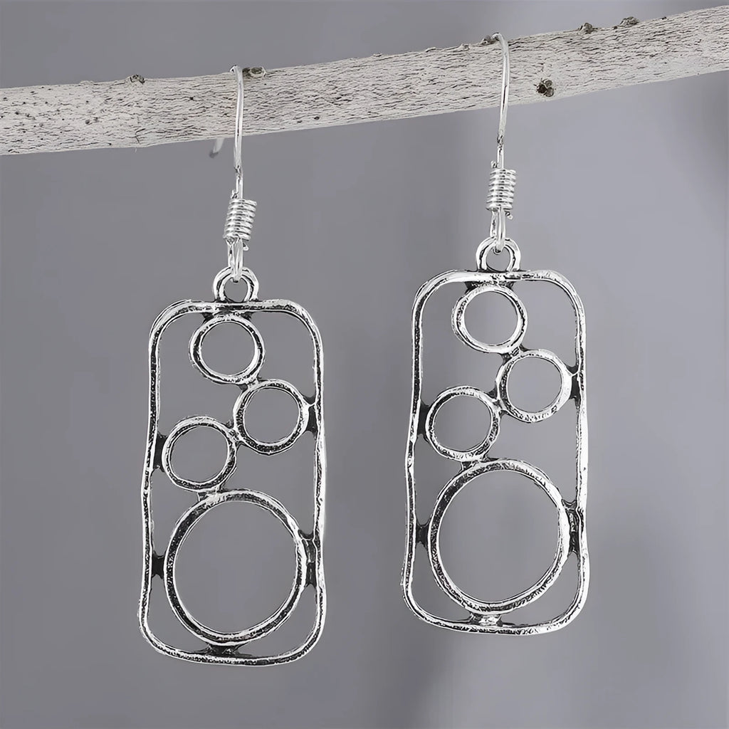 Pair of antique silver geometric earrings with an irregular square stud and round ring on zinc alloy posts.