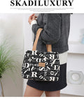 Women's portable printed canvas handbag with floral or animal motifs, aluminium hardware, and horizontal square shape