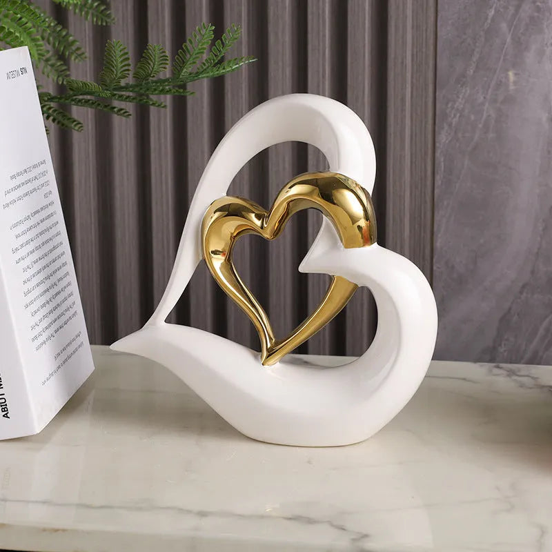 White porcelain love heart ornament with geometric design in metallic finish, approximately 19cm in size