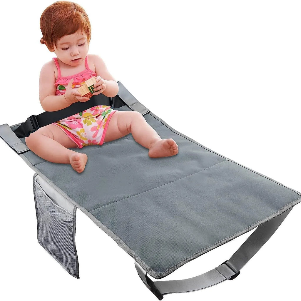 Portable children's aircraft pedal seat extender in black, blue, or grey with drawstring pocket