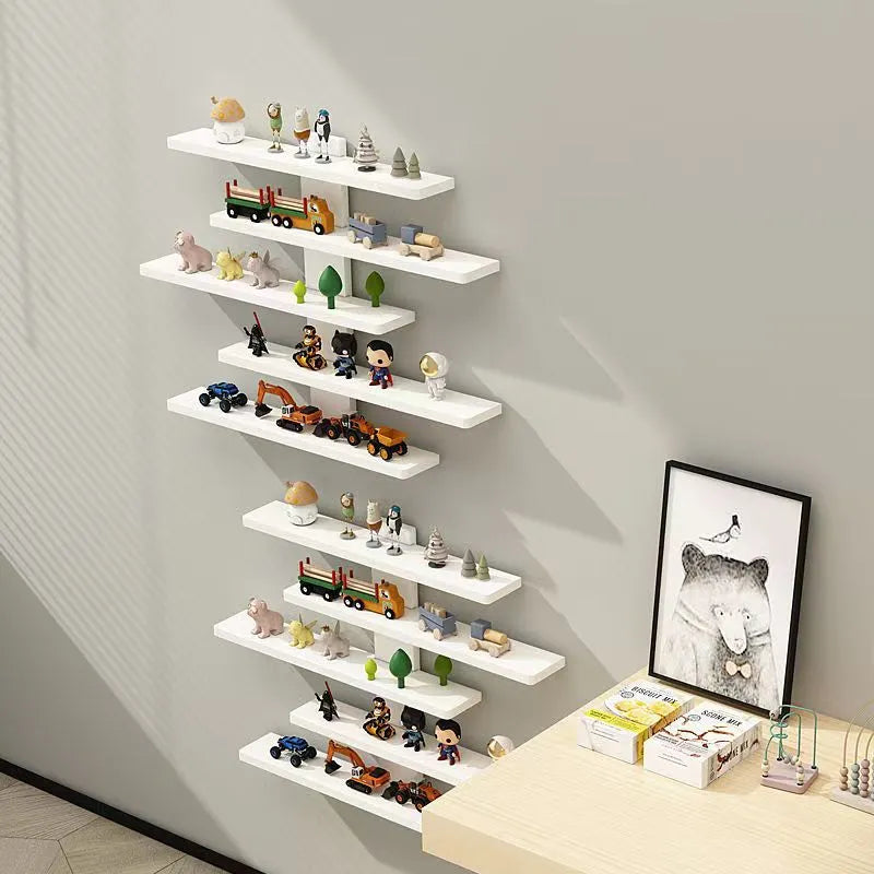 White 5-tier wall-mounted PVC rack displaying a collection of blind box dolls.