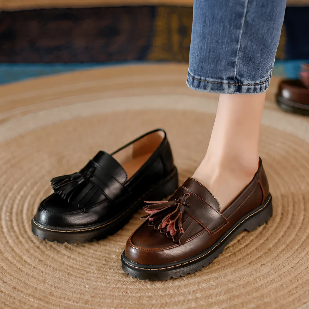 Women's brown leather tassel loafers with a chunky low heel and round toe
