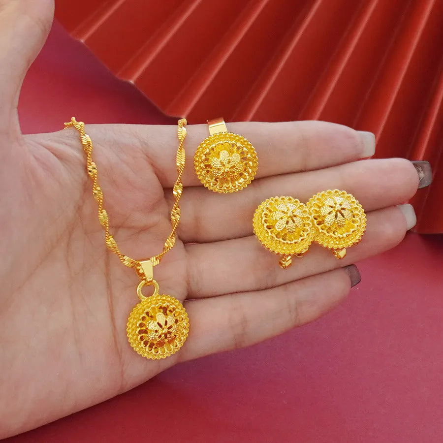 Gold-plated three-piece jewellery set with floral design, showing necklace, earrings, and ring with electroplated finish