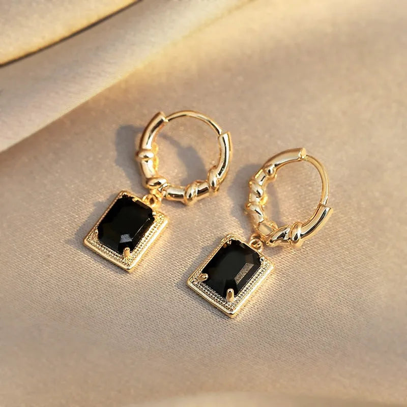 Geometric copper earrings with black zircon accents in quadrilateral design