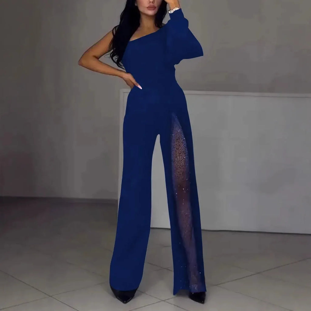 Women's black polyester jumpsuit with oblique shoulder design and high slit, showing mid-waist and long sleeves