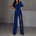 Women's black polyester jumpsuit with oblique shoulder design and high slit, showing mid-waist and long sleeves