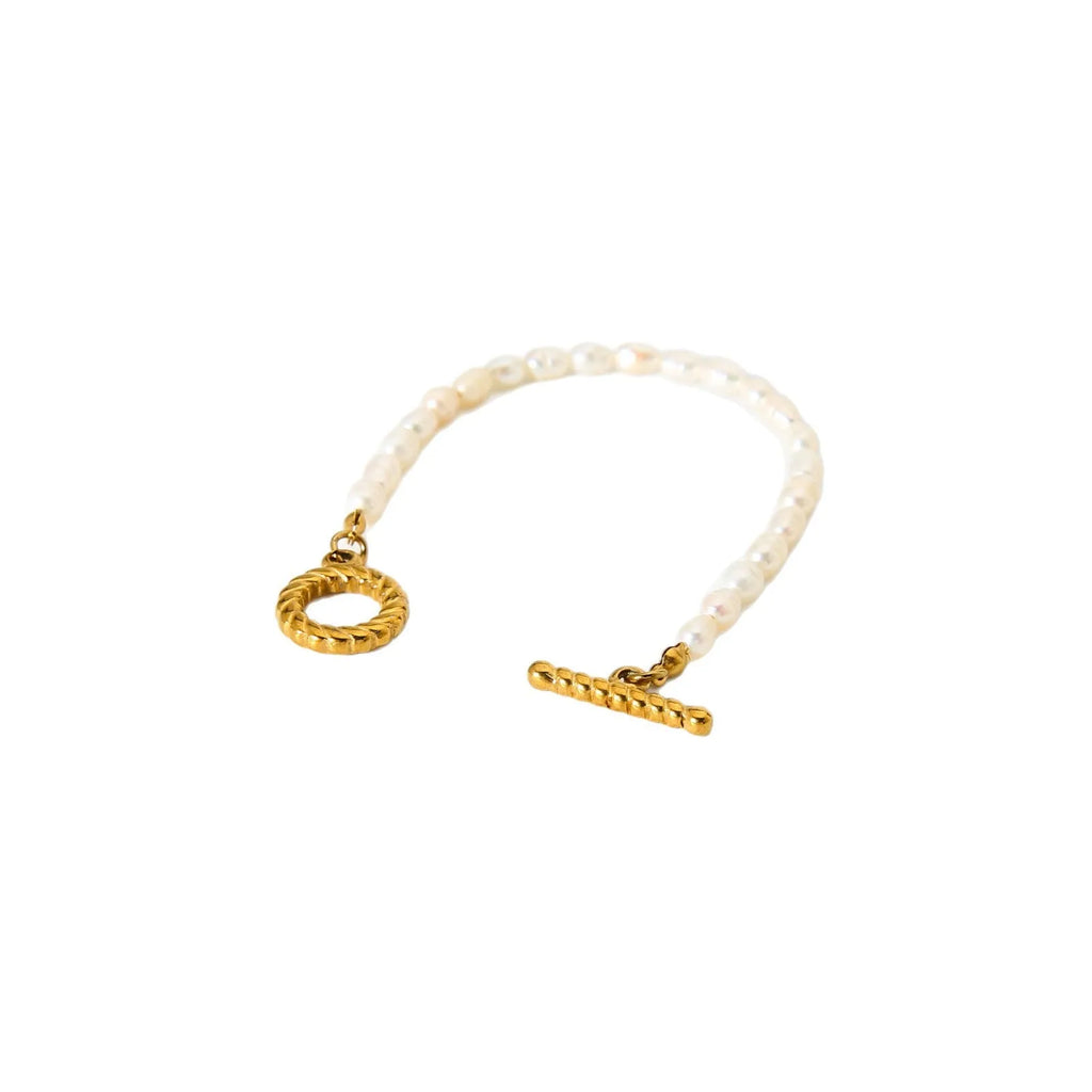 Freshwater pearl and stainless steel geometric pendant necklace and matching bracelet set for women.
