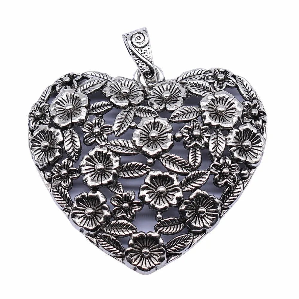 Ancient silver hollow flower alloy pendant measuring 67mm by 58mm
