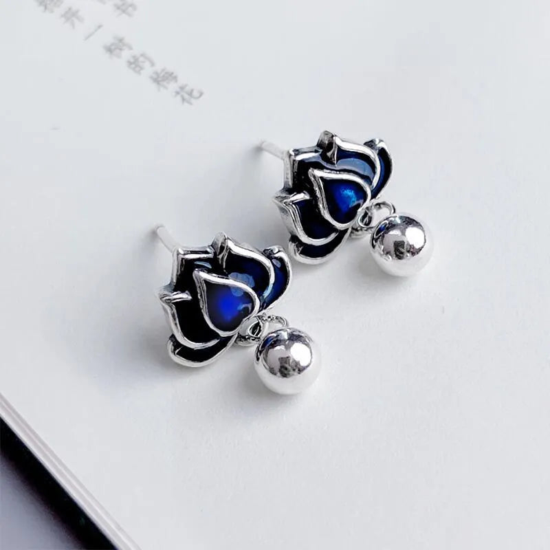 Blue lotus earrings with retro artistic seedpod tassel design, 1.2cm wide alloy studs with silver needle fastening