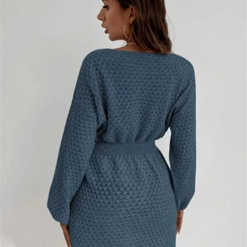 Blue women's knitted dress with hand-crocheted flower details, fitted waist, and 65cm length