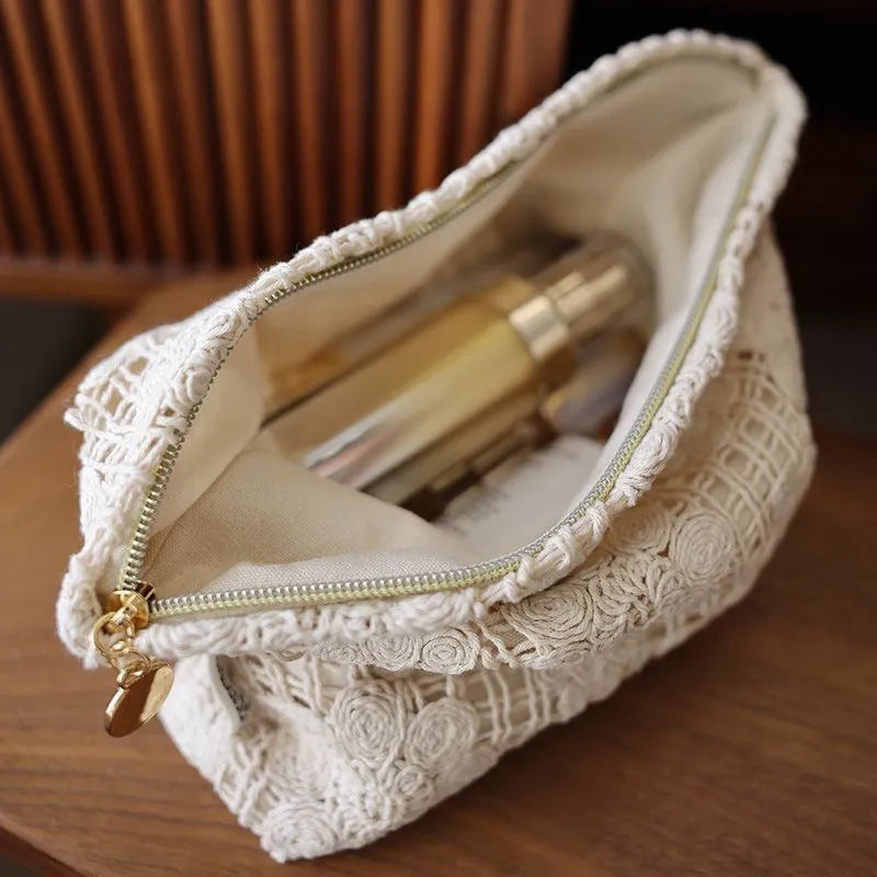 Handmade crocheted hollow flower cosmetic bag with ethnic embroidery on corduroy fabric, rope detailing