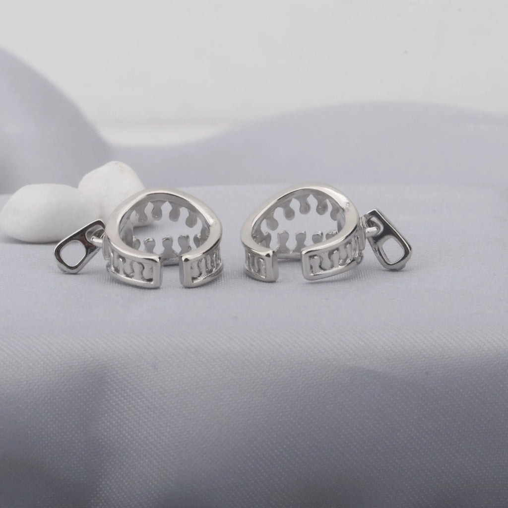 Copper geometric ear clip with zipper closure in ES862 colour, showing simple line design