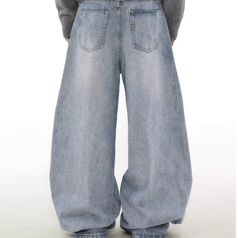 Men's blue straight leg jeans with a distressed retro wash and a mid-rise waist.