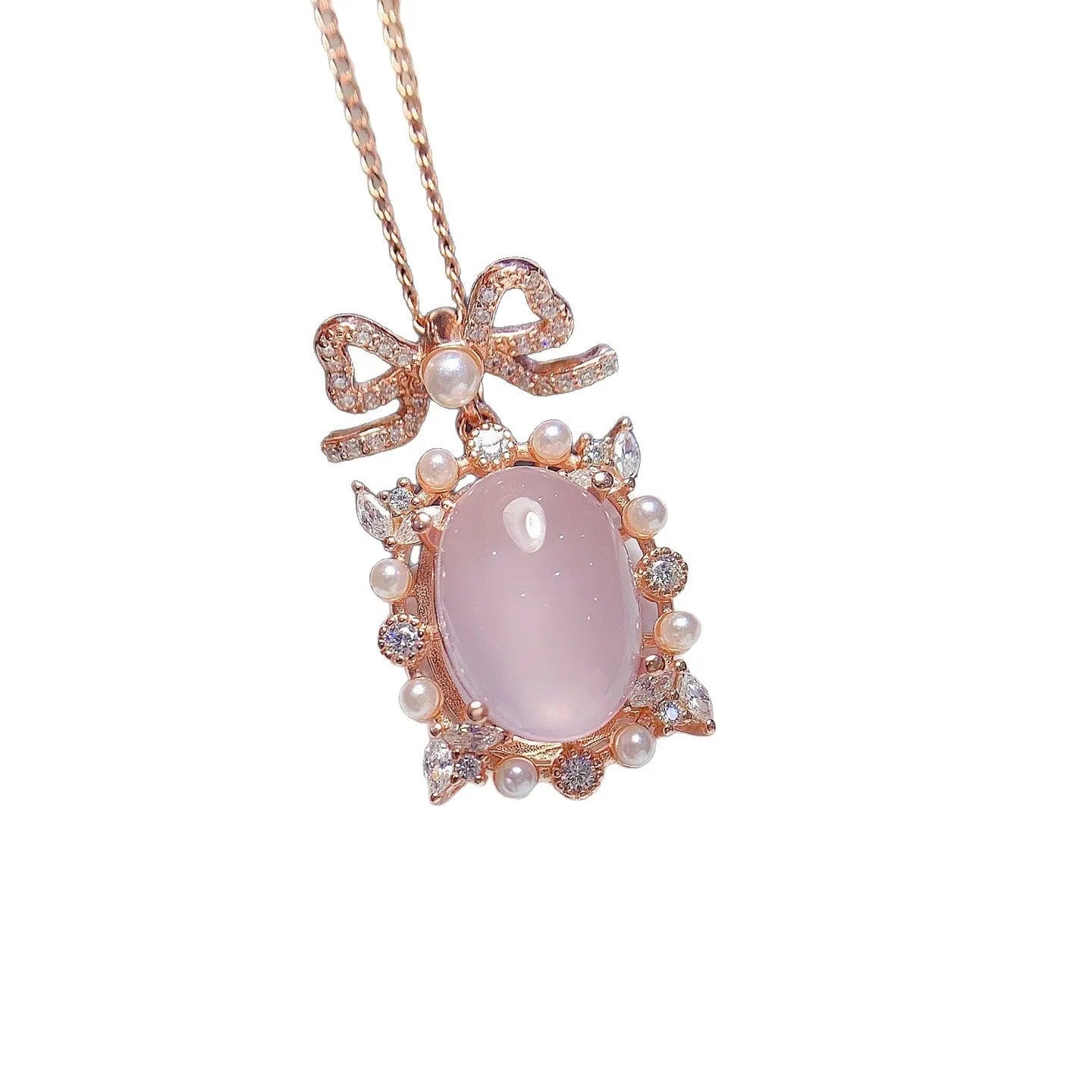 Geometric silver pendant with pink rose quartz crystal and rose gold plating on necklace chain