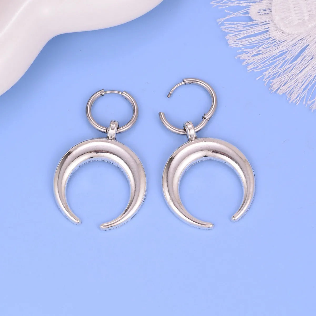 Silver geometric hoop earrings with moon detail, punk-style gothic design, ear clip fastening