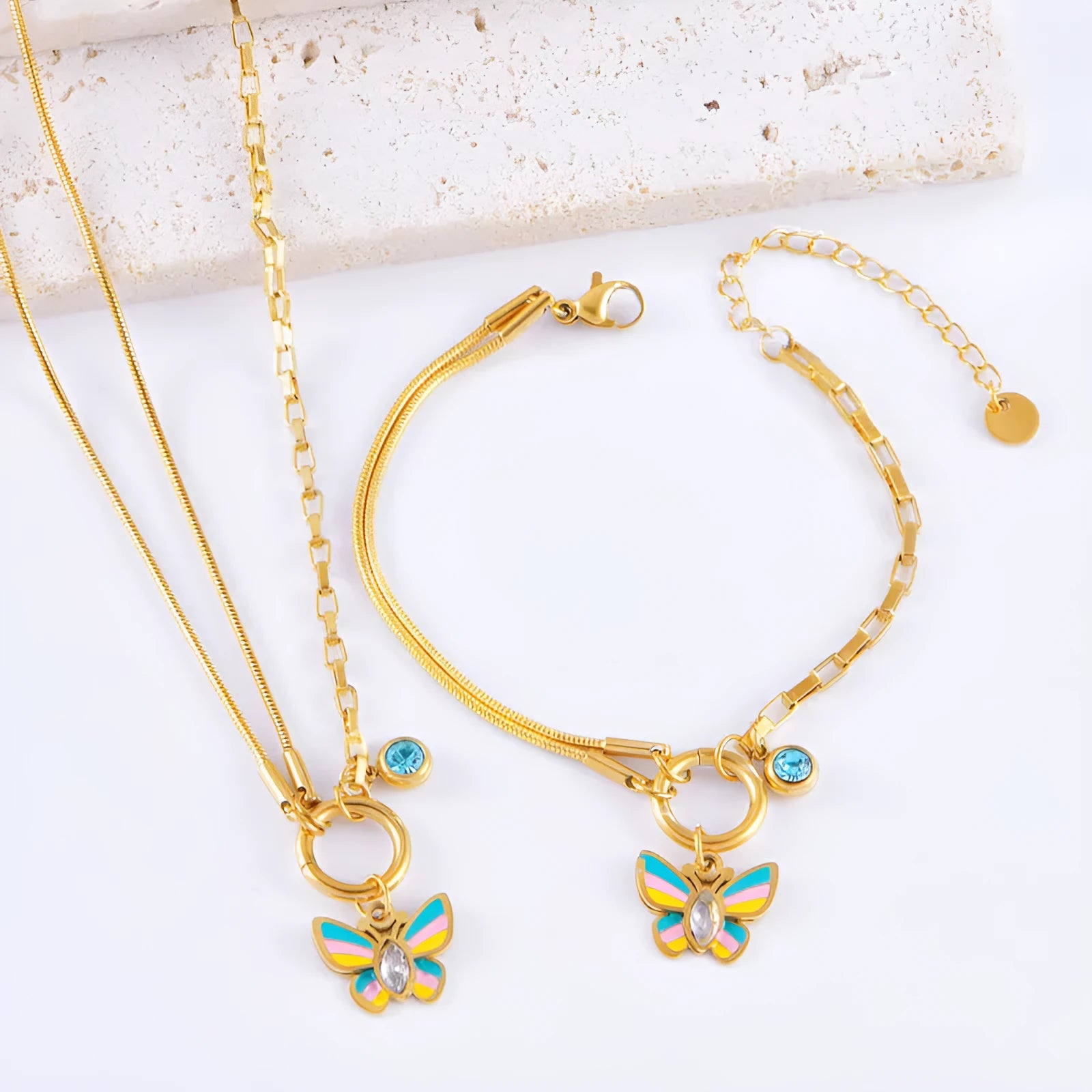 Gold titanium steel necklace and bracelet set with colourful epoxy butterfly and animal zodiac pendants.