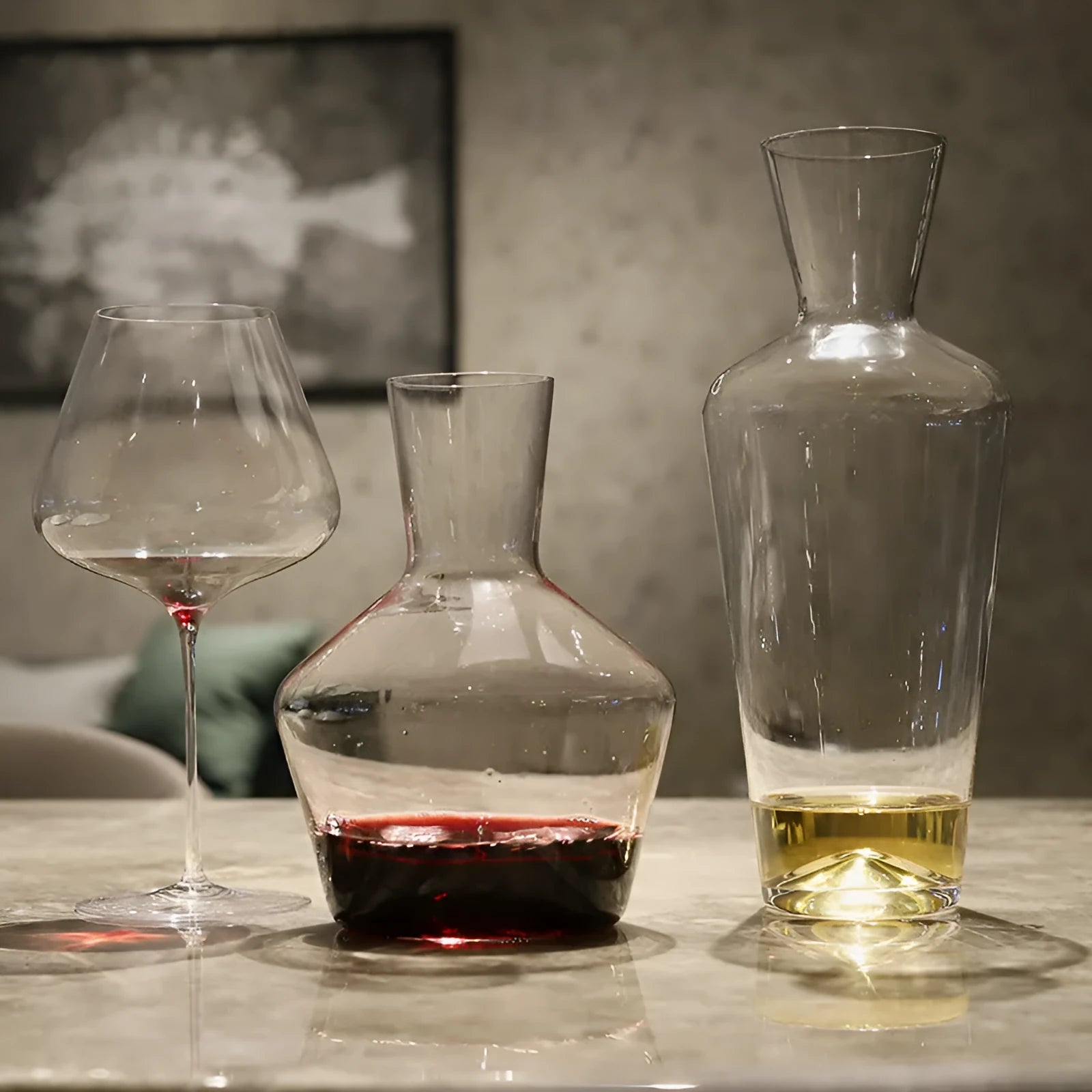 Clear glass wine decanter with removable interior divider shown on a table