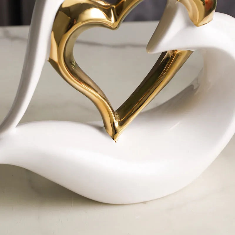 White porcelain love heart ornament with geometric design in metallic finish, approximately 19cm in size