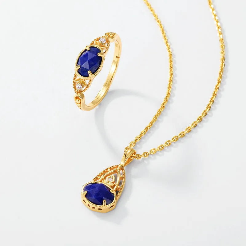 Elliptical lapis lazuli ring with sterling silver setting showing geometric design and natural stone colour variations
