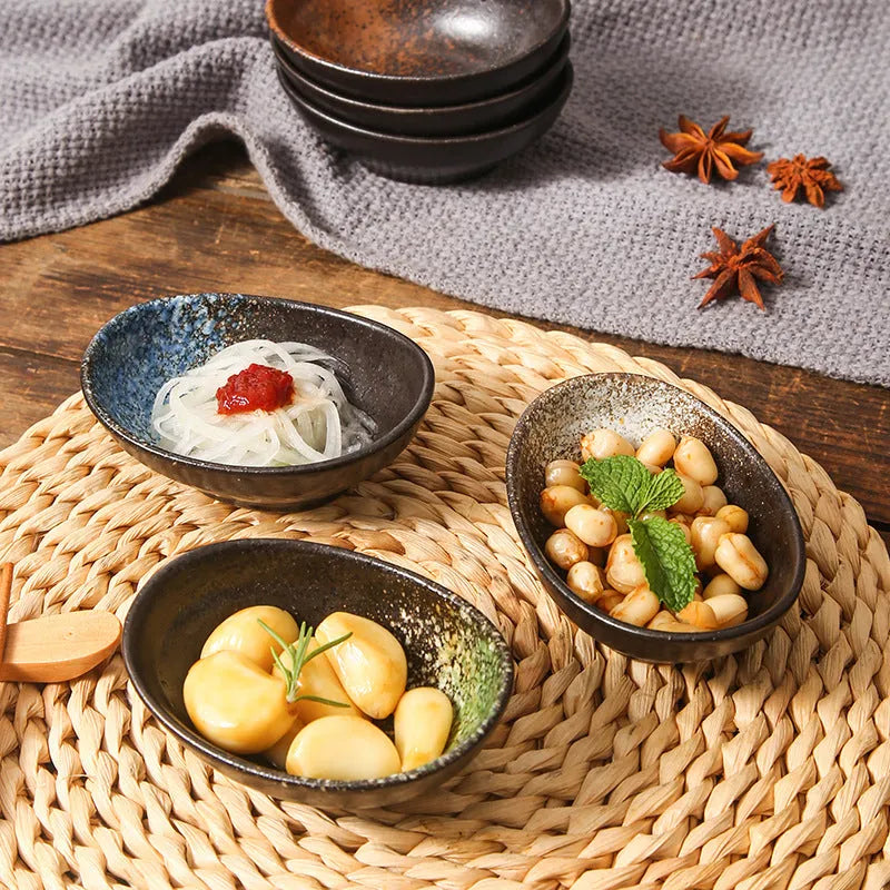 Oval Japanese ceramic sauce dipping bowl with underglaze pattern, measuring 9cm x 6cm x 4cm