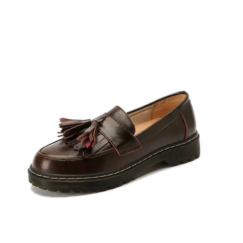 Women's brown leather tassel loafers with a chunky low heel and round toe
