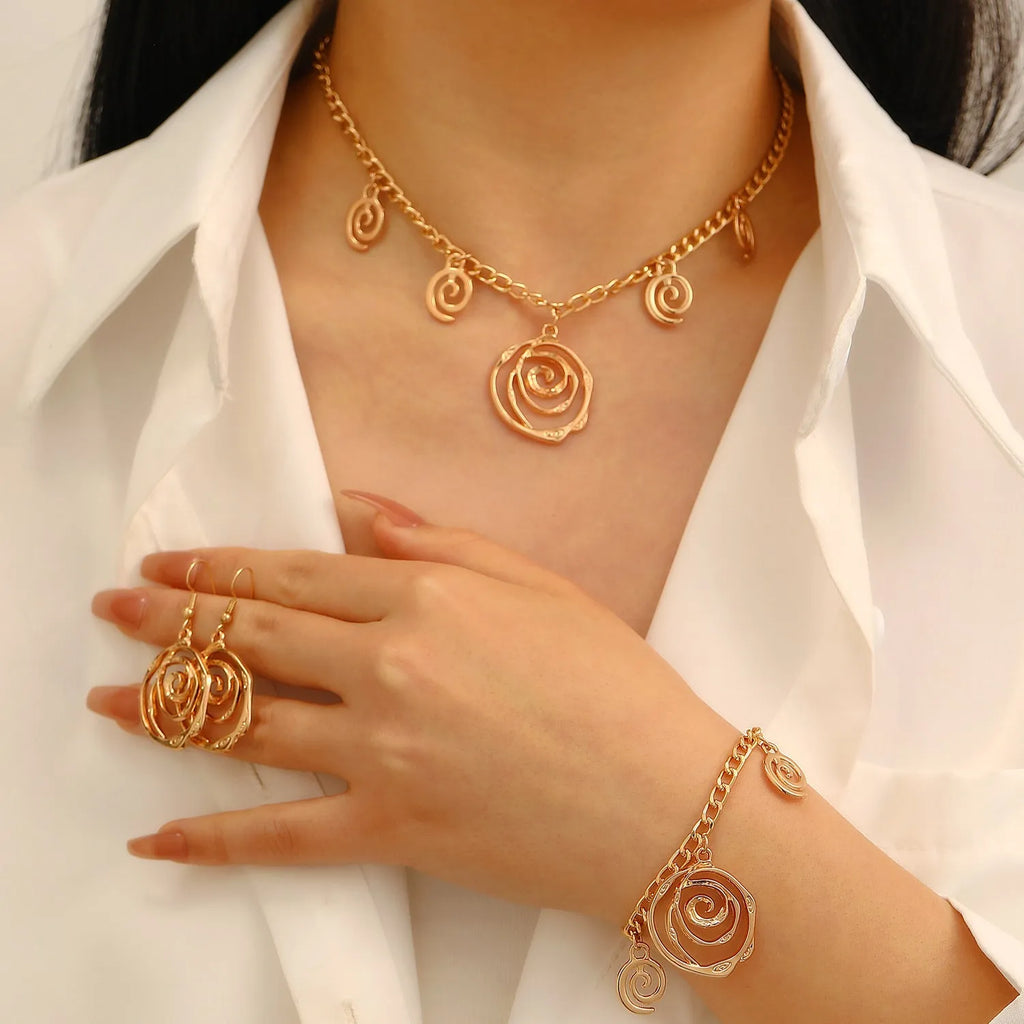 Spiral donut jewellery set with necklace, bracelet, and earrings in gold electroplated alloy