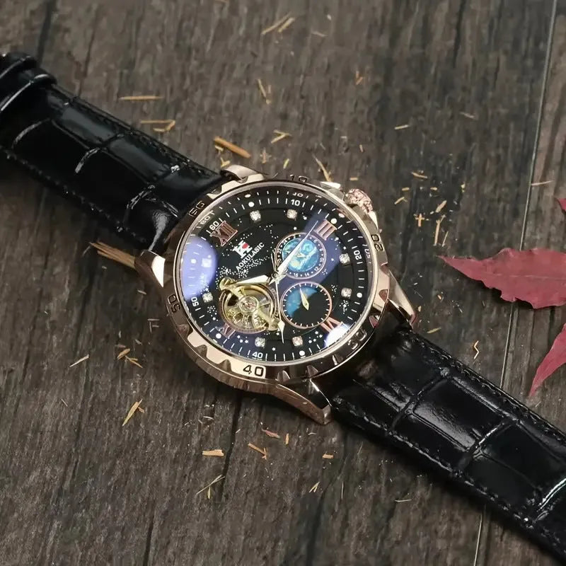 Men's automatic mechanical watch with black dial, rose gold case, and leather strap showing hollow design