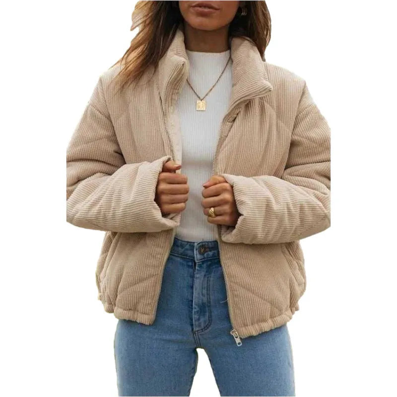 Women's apricot corduroy jacket with stand collar, long sleeves, and zipper closure, showing textured fabric and wadded design.